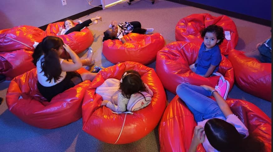 Children gathering in the Living Message Church kids room.
