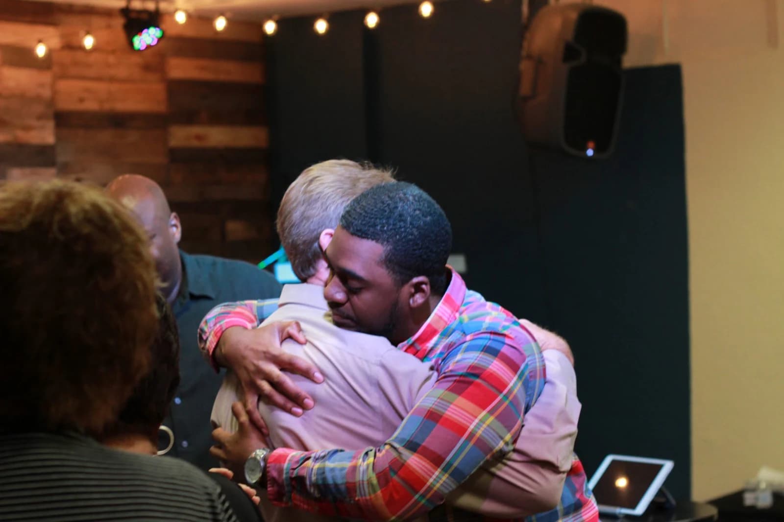Women connecting and praying together at Living Message Church.